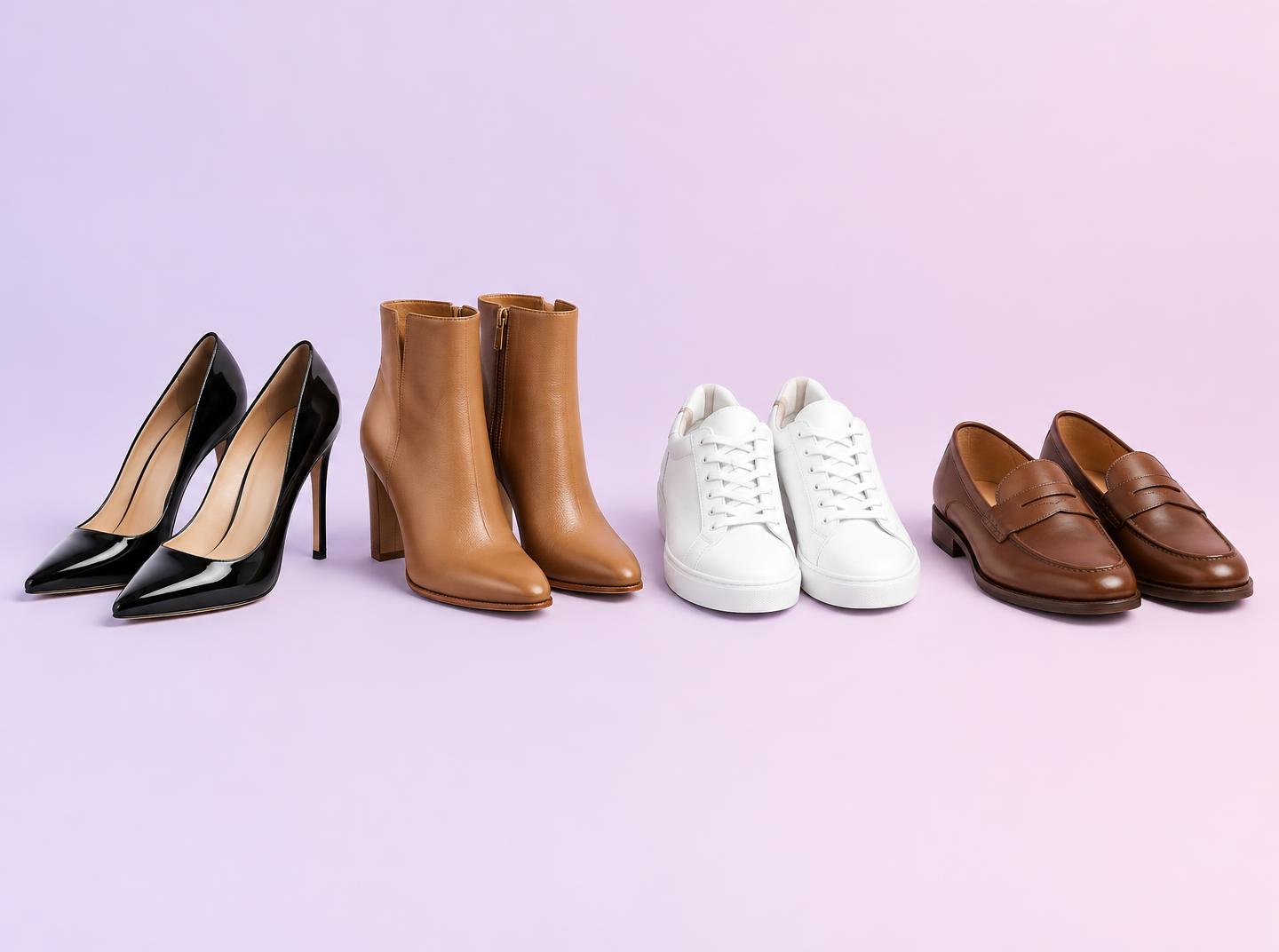 Black heels, tan ankle boots, white sneakers, and brown loafers arranged in a row